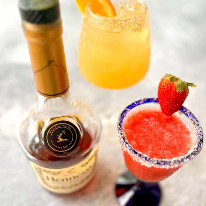 Two cocktails and a bottle of Hennessy