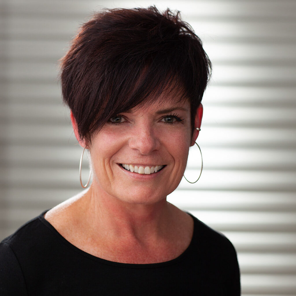 A head shot in front of a white background.