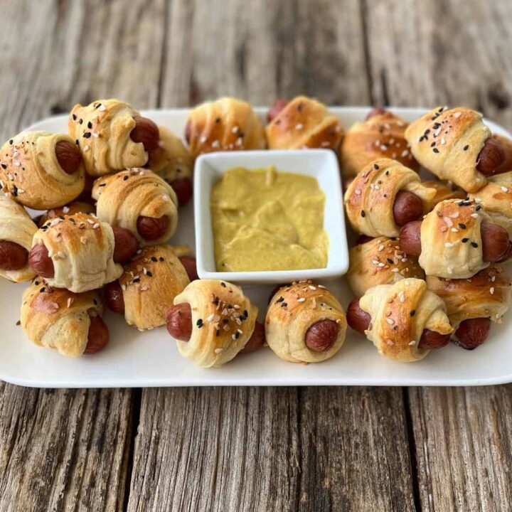 A plate with hot dogs wrapped in puff pastry.