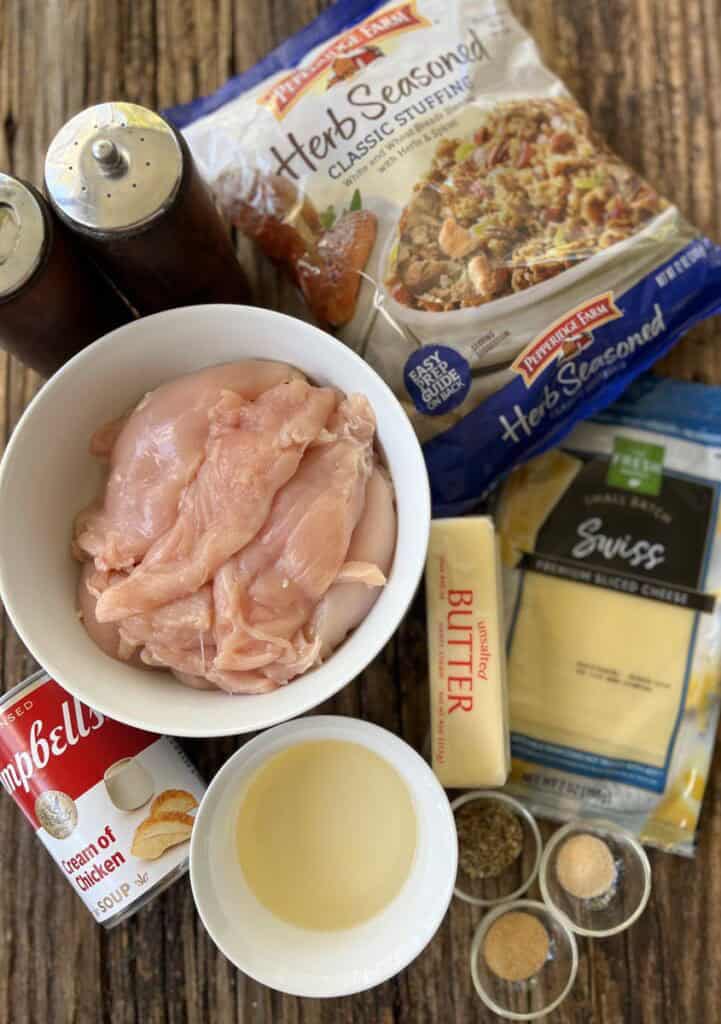Ingredients for chicken casserole on a wood surface.