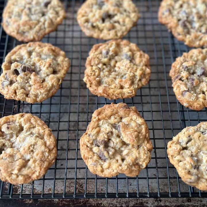 Oatmeal cookies on a cooling rack.