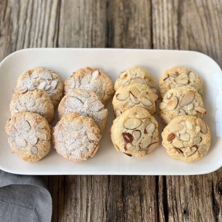 Almond cookies on a white plate.