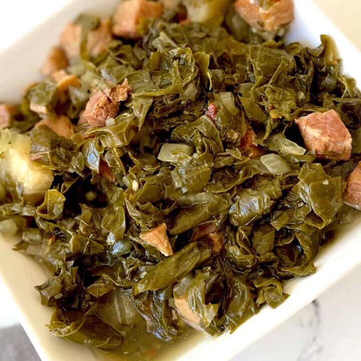 A bowl of turnip greens with ham.