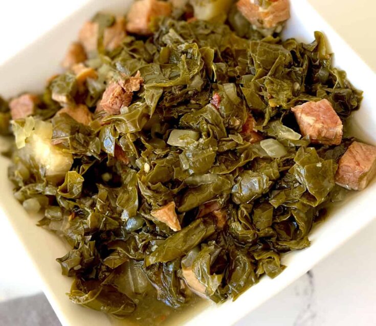A bowl of turnip greens with ham.