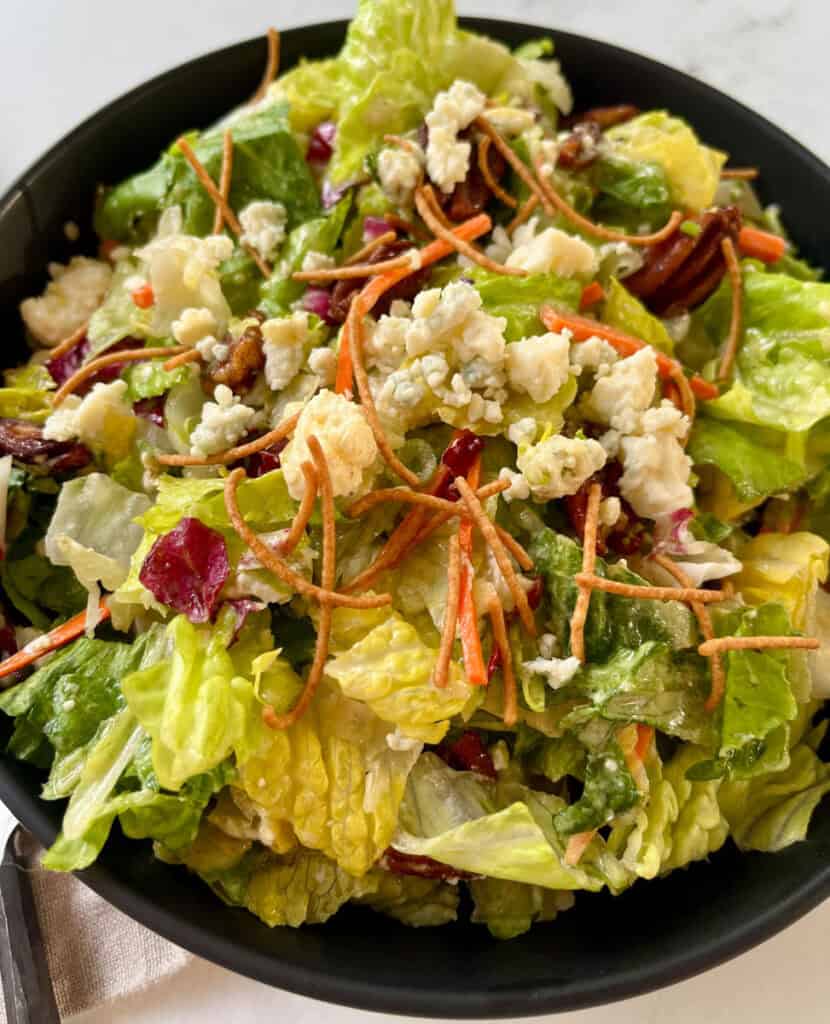 Chopped green salad with blue cheese crumbles.