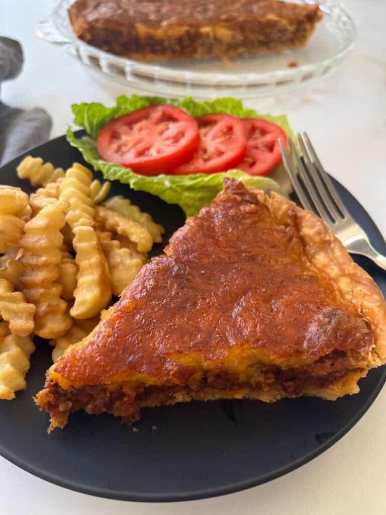 Cheeseburger pie with side dishes.