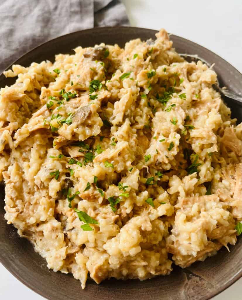 Slow cooker pork chops with mushroom soup and rice.