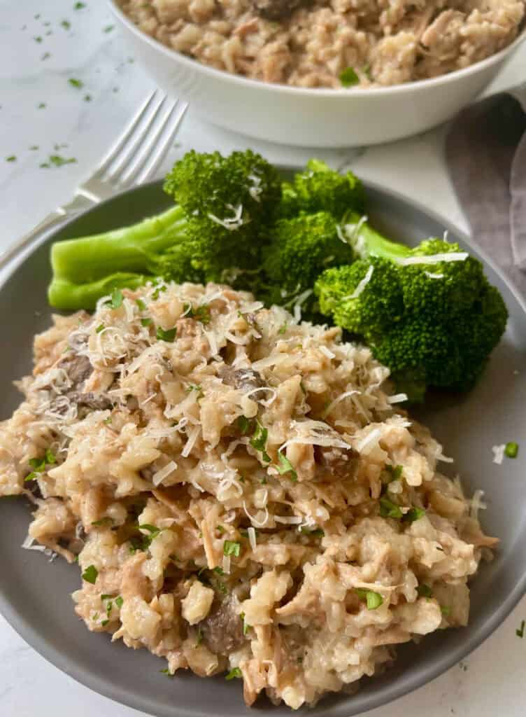 Slow cooker pork chops with mushroom soup and rice with a side of broccoli.