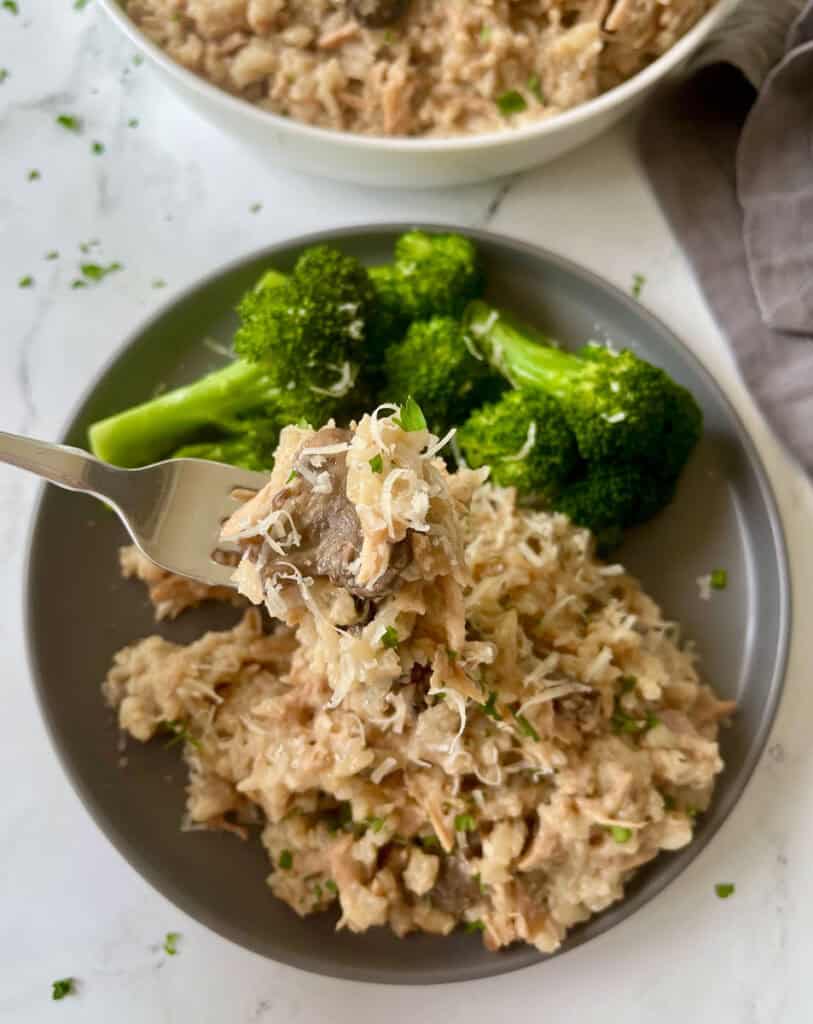 Slow cooker pork chops with rice with a side of broccoli
