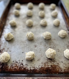 Unbaked cookies on a baking sheet.
