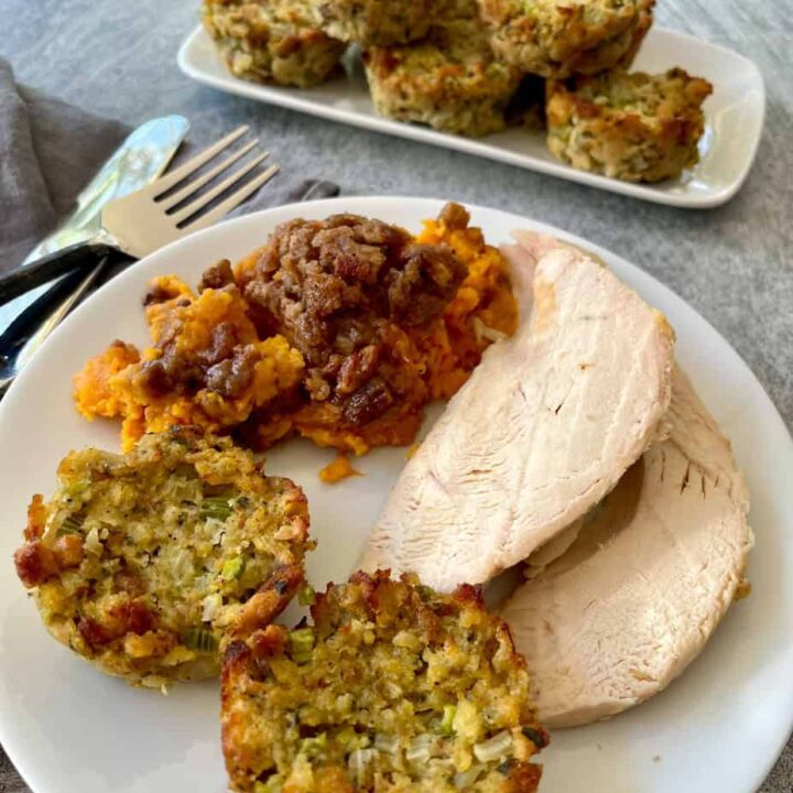 A plate of turkey, stuffing and sweet potato casserole.