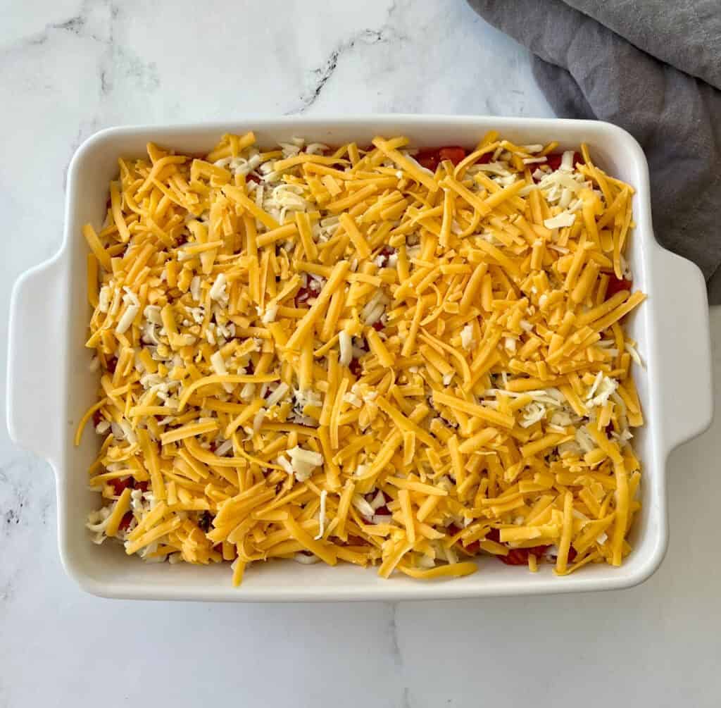Mexican Chicken casserole in a white baking dish.