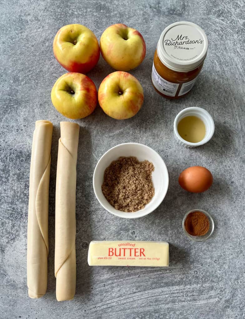 Ingredients for apple dumplings on a table.