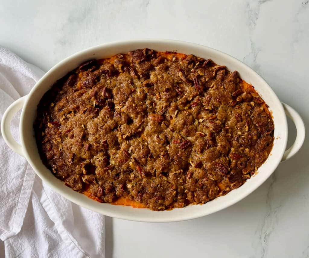 Sweet potato casserole in a white dish.