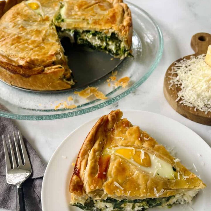Golden spinach and cheese savory pie, homemade comfort food, perfect brunch or dinner option.