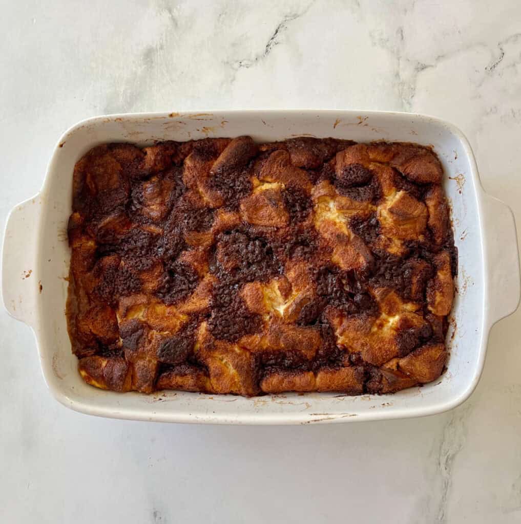 Delicious baked French toast served in a white ceramic dish.