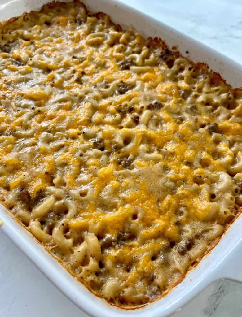 Cheesy baked pasta casserole with ground beef and melted cheese.