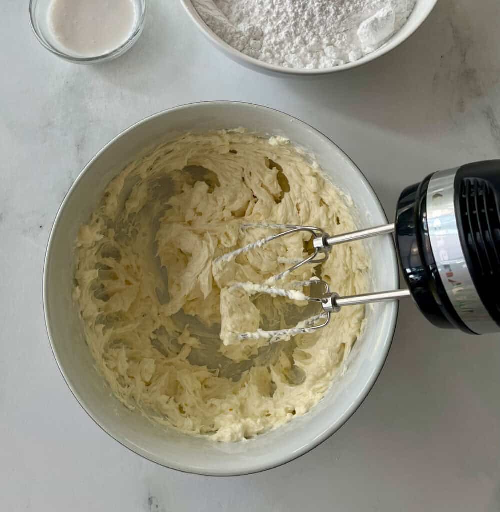 Whipped butter and cream cheese ready for other ingredients to be added for frosting.
