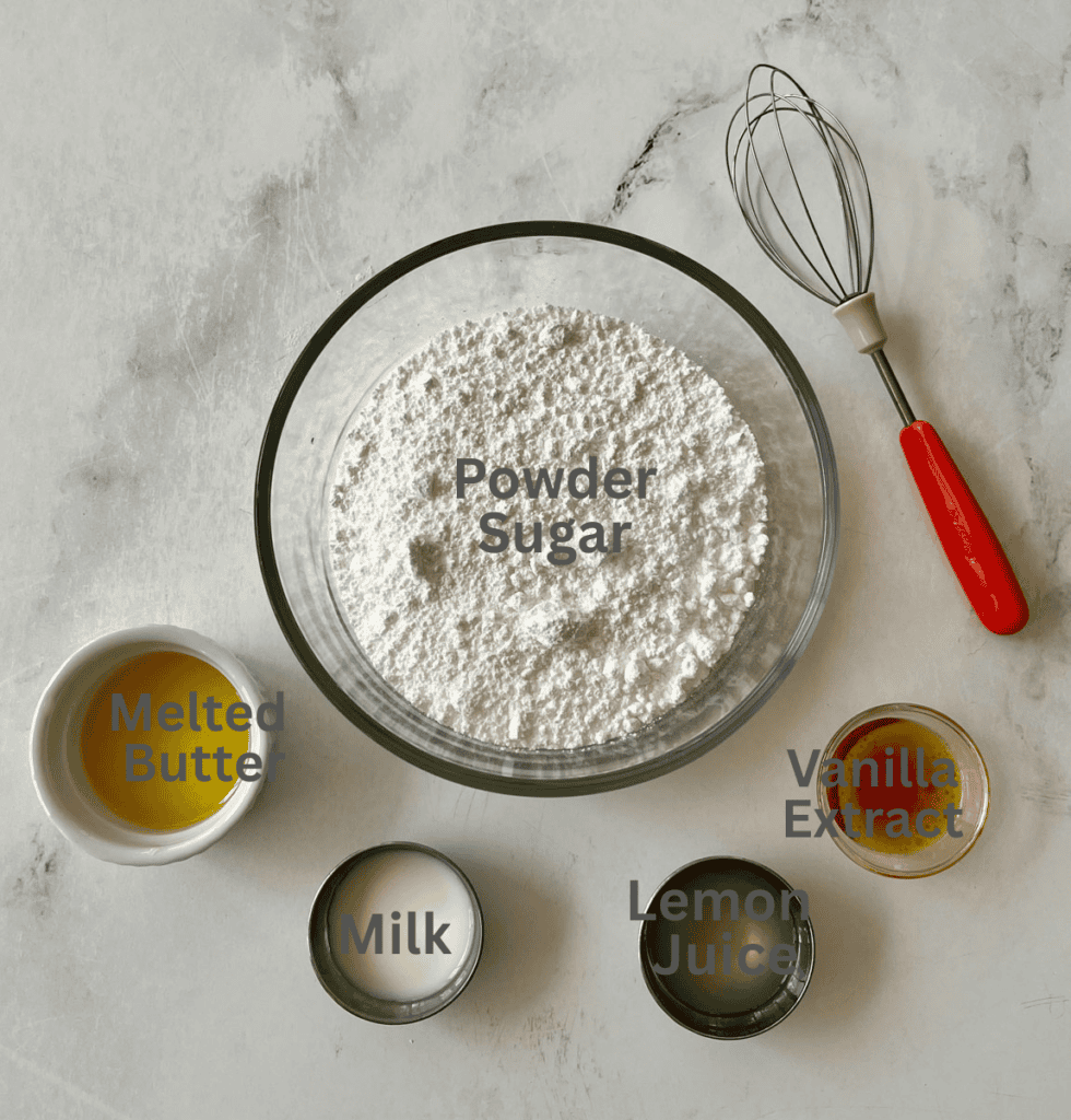 Powdered sugar with melted butter, milk, vanilla, lemon juice on a light surface.
