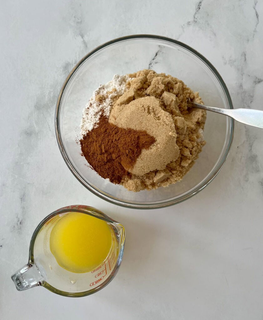 Mixing flour, sugar, cinnamon, and butter for streusel topping.